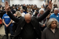 Richard Walker and other opponents of a proposed Atlantic Coast Pipeline compressor station in Buckingham County protested at a State Air Pollution Control Board meeting in December by standing and turning their backs during a Department of Environmental Quality presentation.